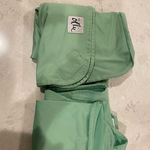 2 Ollie swaddles and one cleaning bag